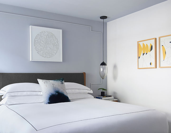 king bed guestroom at kimpton virgilio
